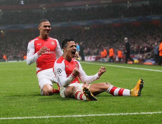 Arsenal s Alexis Sanchez celebrates scoring his sides second goal UEFA Champions League- Arsenal vs Borussia Dortmund- Emirates Stadium - England - 26th November 2014 - EDITORIAL USE ONLY. No use with unauthorised audio, video, data, fixture lists, club league logos or live services. Online in-match use limited to 120 images, no video emulation. No use in betting, games or single club league player publications.
