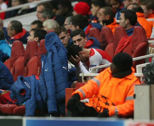 Arsenal s Mikel Arteta looks on dejected after getting injured again UEFA Champions League- Arsenal vs Borussia Dortmund- Emirates Stadium - England - 26th November 2014 - EDITORIAL USE ONLY. No use with unauthorised audio, video, data, fixture lists, club league logos or live services. Online in-match use limited to 120 images, no video emulation. No use in betting, games or single club league player publications.