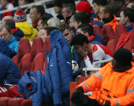 Arsenal s Mikel Arteta looks on dejected after getting injured again UEFA Champions League- Arsenal vs Borussia Dortmund- Emirates Stadium - England - 26th November 2014 - EDITORIAL USE ONLY. No use with unauthorised audio, video, data, fixture lists, club league logos or live services. Online in-match use limited to 120 images, no video emulation. No use in betting, games or single club league player publications.