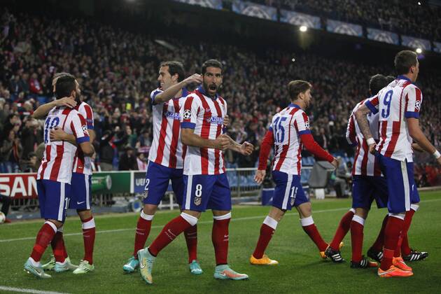 Atletico de Madrid s Raul Garcia celebrates a goal with his mates during Champions League soccer match between Atletico de Madrid and Olympiacos at Vicente Calderon stadium in Madrid, Spain. November 26, 2014.  (2014112625918)