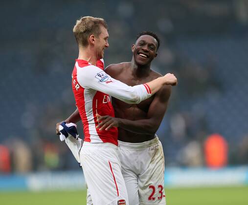 Arsenal s Danny Welbeck celebrates at the final whistle with Per Mertesacker - Barclays Premier League - West Bromwich Albion vs FC Arsenal London - The Hawthorns - England - 29th November 2014 - EDITORIAL USE ONLY. No use with unauthorised audio, video, data, fixture lists, club league logos or live services. Online in-match use limited to 120 images, no video emulation. No use in betting, games or single club league player publications.