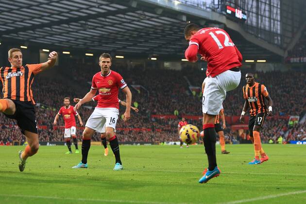 Chris Smalling of Manchester United scores the opening goal - Manchester United (ManU) vs. Hull City - Barclay s Premier League - Old Trafford - Manchester - 29 11 2014 - EDITORIAL USE ONLY. No use with unauthorised audio, video, data, fixture lists, club league logos or live services. Online in-match use limited to 120 images, no video emulation. No use in betting, games or single club league player publications.