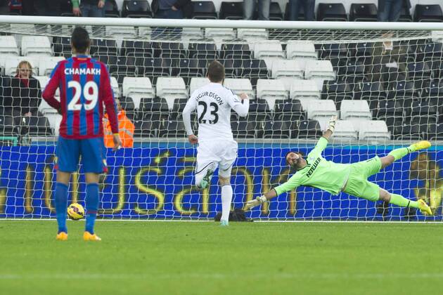 Football - 2014 2015 Premier League - Swansea City vs. Crystal Palace Wilfried Bony of Swansea scores their 1st goal past a diving Julián Speroni of Crystal Palace at The Liberty Stadium. COLORSPORT WINSTON BYNORTH 
