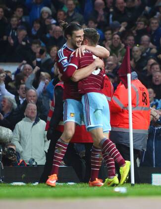 29.11.2014. London, England. Premier League. West Ham United versus Newcastle United from The Boelyn Ground. West Ham United forward Andy Carroll and West Ham United defender Aaron Cresswell celebrate the first goal. xChakirxDahmanix  ActionPlus11579959