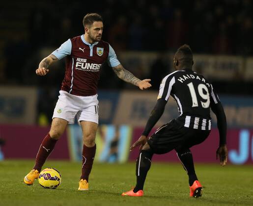 Danny Ings of Burnley held up by Massadio Haidara of Newcastle United - Barclays Premier League - Burnley vs Newcastle Utd - Turf Moor Stadium - England - 2nd December 2014 - EDITORIAL USE ONLY. No use with unauthorised audio, video, data, fixture lists, club league logos or live services. Online in-match use limited to 120 images, no video emulation. No use in betting, games or single club league player publications.