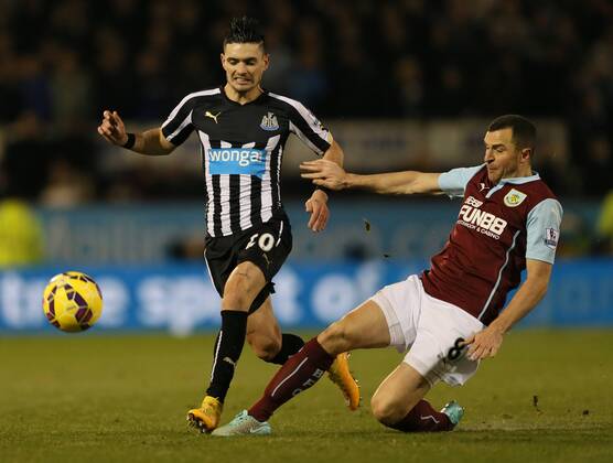 Remy Cabella of Newcastle United challenged by Dean Marney of Burnley - Barclays Premier League - Burnley vs Newcastle Utd - Turf Moor Stadium - England - 2nd December 2014 - EDITORIAL USE ONLY. No use with unauthorised audio, video, data, fixture lists, club league logos or live services. Online in-match use limited to 120 images, no video emulation. No use in betting, games or single club league player publications.