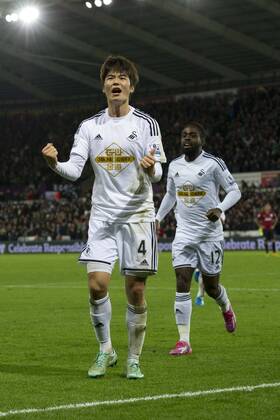 Football - 2014 2015 Premier League - Swansea City vs. Queens Park Rangers Ki Sung-Yueng of Swansea celebrates scoring their 1st goal at The Liberty Stadium. COLORSPORT WINSTON BYNORTH 