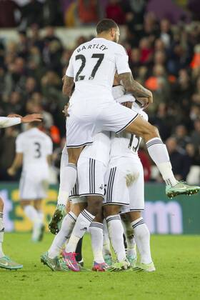 Football - 2014 2015 Premier League - Swansea City vs. Queens Park Rangers Swansea celebrate their 2nd goal at The Liberty Stadium. COLORSPORT WINSTON BYNORTH 
