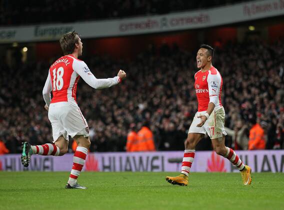 Arsenal s Alexis Sanchez celebrates scoring his sides opening goal Barclays Premier League- Arsenal vs Southampton - Emirates Stadium - England - 3rd December 2014 - Picture David Klein Sportimage EDITORIAL USE ONLY. No use with unauthorised audio, video, data, fixture lists, club league logos or live services. Online in-match use limited to 120 images, no video emulation. No use in betting, games or single club league player publications.