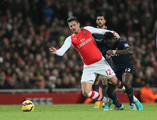 Arsenal s Olivier Giroud tussles with Southampton s Victor Wanyama Barclays Premier League- Arsenal vs Southampton - Emirates Stadium - England - 3rd December 2014 - Picture David Klein Sportimage EDITORIAL USE ONLY. No use with unauthorised audio, video, data, fixture lists, club league logos or live services. Online in-match use limited to 120 images, no video emulation. No use in betting, games or single club league player publications.