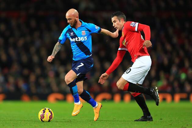 Robin van Persie of Manchester United ManU tracks Stoke?s Stephen Ireland - Manchester United vs. Stoke City - Barclay s Premier League - Old Trafford - Manchester - 02 12 2014 Pic Philip Oldham Sportimage EDITORIAL USE ONLY. No use with unauthorised audio, video, data, fixture lists, club league logos or live services. Online in-match use limited to 120 images, no video emulation. No use in betting, games or single club league player publications.