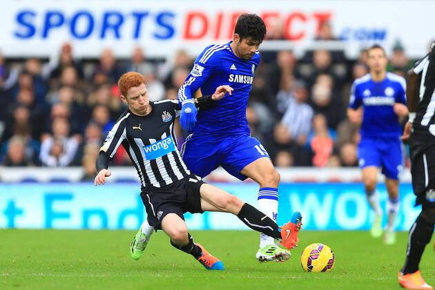 Jack Colback of Newcastle United tackles Diego Costa of Chelsea - Newcastle United vs. Chelsea - Barclay s Premier League - St James Park - Newcastle- 06 12 2014 Pic Philip Oldham Sportimage EDITORIAL USE ONLY. No use with unauthorised audio, video, data, fixture lists, club league logos or live services. Online in-match use limited to 120 images, no video emulation. No use in betting, games or single club league player publications.