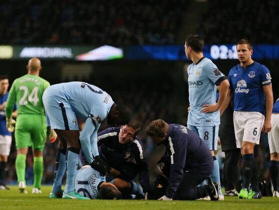 Medical staff treat Sergio - Kun - Agüero of Manchester City - Barclays Premier League - Manchester City vs FC Everton - Etihad Stadium - Manchester - England - 6th December 2014 - EDITORIAL USE ONLY. No use with unauthorised audio, video, data, fixture lists, club league logos or live services. Online in-match use limited to 120 images, no video emulation. No use in betting, games or single club league player publications.