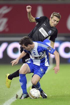 - GENT, BELGIUM: Gent s Brecht Dejaegere and Genk s Timothy Castagne fight for the ball during the Jupiler Pro League match between KAA Gent and KRC Genk, in Gent, Sunday 07 December 2014, on day 18 of the Belgian soccer championship. YORICKxJANSENS x04516835x