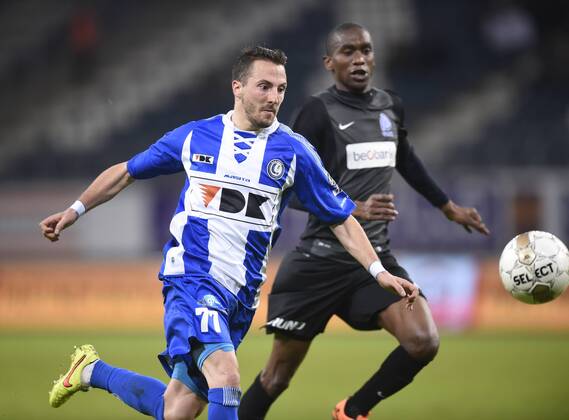 - GENT, BELGIUM: Gent s Danijel Milicevic and Genk s Ngongca Anele fight for the ball during the Jupiler Pro League match between KAA Gent and KRC Genk, in Gent, Sunday 07 December 2014, on day 18 of the Belgian soccer championship. JOHNxTHYS x04516915x