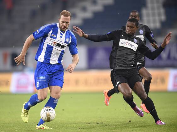 - GENT, BELGIUM: Gent s Laurent Depoitre and Genk s Christian Kabasele fight for the ball during the Jupiler Pro League match between KAA Gent and KRC Genk, in Gent, Sunday 07 December 2014, on day 18 of the Belgian soccer championship. JOHNxTHYS x04516925x
