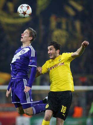 - DORTMUND, GERMANY: Anderlecht s Dennis Praet and Dortmund s Nuri Sahin fight for the ball during a soccer game between German team Borussia Dortmund and Belgium s RSC Anderlecht, Tuesday 09 December 2014 in Dortmund, Germany, on the sixth and last day of the group stage of the UEFA Champions League competition, in the group D VIRGINIExLEFOUR  x04518375x