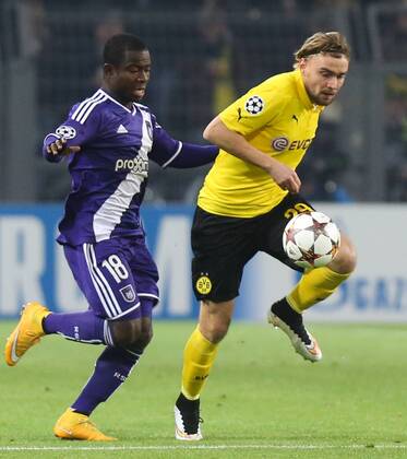 - DORTMUND, GERMANY: Anderlecht s Frank Acheampong and Dortmund s Marcel Schmelzer fight for the ball during a soccer game between German team Borussia Dortmund and Belgium s RSC Anderlecht, Tuesday 09 December 2014 in Dortmund, Germany, on the sixth and last day of the group stage of the UEFA Champions League competition, in the group D VIRGINIExLEFOUR  x04518376x