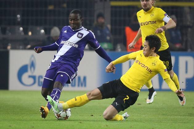 - DORTMUND, GERMANY: Anderlecht s Frank Acheampong and Dortmund s Shinji Kagawa fight for the ball during a soccer game between German team Borussia Dortmund and Belgium s RSC Anderlecht, Tuesday 09 December 2014 in Dortmund, Germany, on the sixth and last day of the group stage of the UEFA Champions League competition, in the group D VIRGINIExLEFOUR  x04518378x