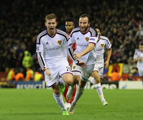 Fabian Frei of Basel (l) celebrates scoring the first goal - UEFA Champions League group B - Liverpool vs Basel - Anfield Stadium - Liverpool - England - 9th December 2014 - Picture Simon Bellis Sportimage EDITORIAL USE ONLY. No use with unauthorised audio, video, data, fixture lists, club league logos or live services. Online in-match use limited to 120 images, no video emulation. No use in betting, games or single club league player publications.