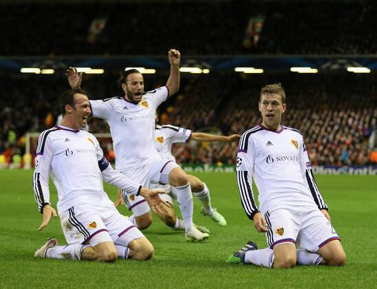 Fabian Frei of Basel (r) celebrates scoring the first goal - UEFA Champions League group B - Liverpool vs Basel - Anfield Stadium - Liverpool - England - 9th December 2014 - Picture Simon Bellis Sportimage EDITORIAL USE ONLY. No use with unauthorised audio, video, data, fixture lists, club league logos or live services. Online in-match use limited to 120 images, no video emulation. No use in betting, games or single club league player publications.