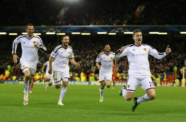 Fabian Frei of Basel (r) celebrates scoring the first goal - UEFA Champions League group B - Liverpool vs Basel - Anfield Stadium - Liverpool - England - 9th December 2014 - Picture Simon Bellis Sportimage EDITORIAL USE ONLY. No use with unauthorised audio, video, data, fixture lists, club league logos or live services. Online in-match use limited to 120 images, no video emulation. No use in betting, games or single club league player publications.