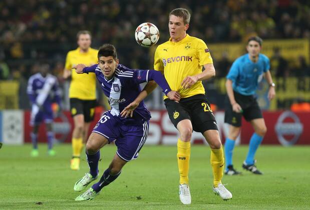 - DORTMUND, GERMANY: Anderlecht s Alexandar Mitrovic and Dortmund s Matthias Ginter fight for the ball during a soccer game between German team Borussia Dortmund and Belgium s RSC Anderlecht, Tuesday 09 December 2014 in Dortmund, Germany, on the sixth and last day of the group stage of the UEFA Champions League competition, in the group D VIRGINIExLEFOUR  x04518393x