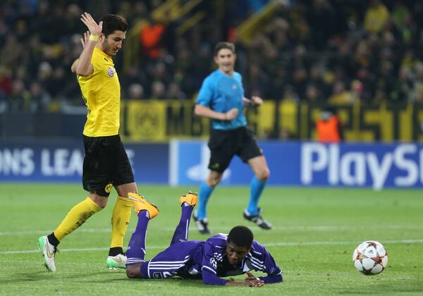 - DORTMUND, GERMANY: Dortmund s Nuri Sahin and Anderlecht s Ibrahima Conte fight for the ball during a soccer game between German team Borussia Dortmund and Belgium s RSC Anderlecht, Tuesday 09 December 2014 in Dortmund, Germany, on the sixth and last day of the group stage of the UEFA Champions League competition, in the group D VIRGINIExLEFOUR  x04518408x