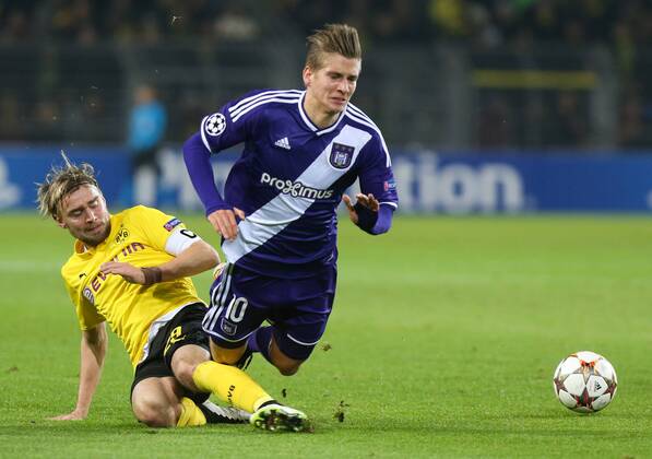- DORTMUND, GERMANY: Dortmund s Marcel Schmelzer and Anderlecht s Dennis Praet fight for the ball during a soccer game between German team Borussia Dortmund and Belgium s RSC Anderlecht, Tuesday 09 December 2014 in Dortmund, Germany, on the sixth and last day of the group stage of the UEFA Champions League competition, in the group D VIRGINIExLEFOUR  x04518420x