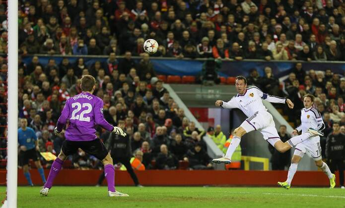 Marco Stroller of Basel volleys wide past Simon Mignolet of Liverpool - UEFA Champions League group B - Liverpool vs Basel - Anfield Stadium - Liverpool - England - 9th December 2014 - Picture Simon Bellis Sportimage EDITORIAL USE ONLY. No use with unauthorised audio, video, data, fixture lists, club league logos or live services. Online in-match use limited to 120 images, no video emulation. No use in betting, games or single club league player publications.