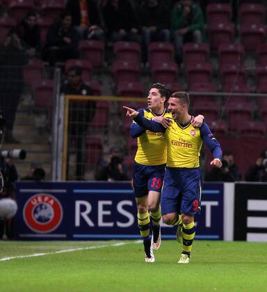 UEFA Champions League Group D match between Galatasaray and Arsenal at Turk Telekom Arena Stadium on December 09, 2014 in Istanbul, Turkey Pictured: Hector Bellerin (L) and Lukas Podolski (R) of Arsenal. 