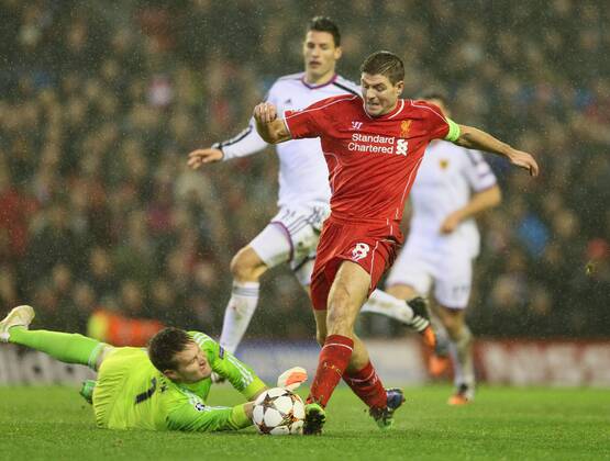 Steven Gerrard of Liverpool brought down by Tomas Vaclik of Basel - UEFA Champions League group B - Liverpool vs Basel - Anfield Stadium - Liverpool - England - 9th December 2014 - Picture Simon Bellis Sportimage EDITORIAL USE ONLY. No use with unauthorised audio, video, data, fixture lists, club league logos or live services. Online in-match use limited to 120 images, no video emulation. No use in betting, games or single club league player publications.