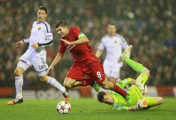 Steven Gerrard of Liverpool brought down by Tomas Vaclik of Basel - UEFA Champions League group B - Liverpool vs Basel - Anfield Stadium - Liverpool - England - 9th December 2014 - Picture Simon Bellis Sportimage EDITORIAL USE ONLY. No use with unauthorised audio, video, data, fixture lists, club league logos or live services. Online in-match use limited to 120 images, no video emulation. No use in betting, games or single club league player publications.