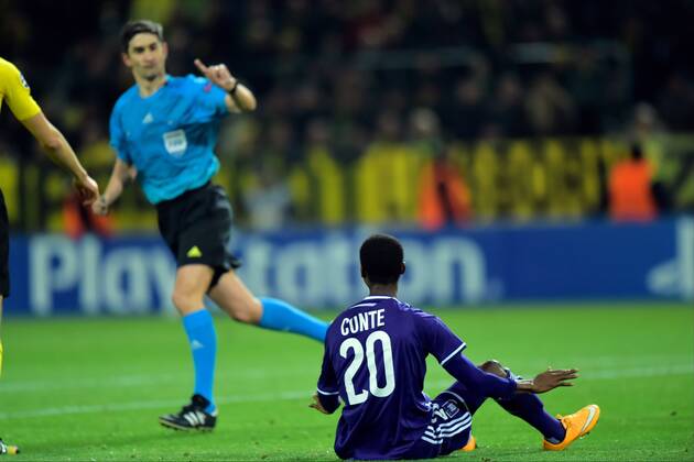 Ibrahima Conte of RSC Anderlecht - referee Alberto Undiano Mallenco FOOTBALL : Borussia Dortmund vs RSC Anderlecht - UEFA Champions League 2014 2015 - 09 12 2014 PhotoNews Panoramic 