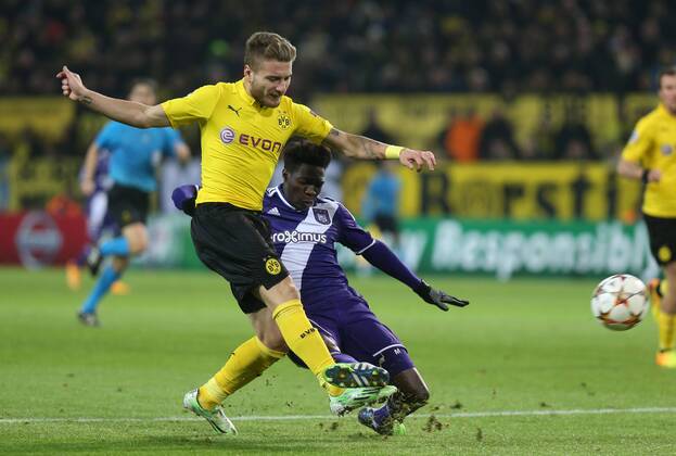 - DORTMUND, GERMANY: Dortmund s Ciro Immobile and Anderlecht s Fabrice N Sakala fight for the ball during a soccer game between German team Borussia Dortmund and Belgium s RSC Anderlecht, Tuesday 09 December 2014 in Dortmund, Germany, on the sixth and last day of the group stage of the UEFA Champions League competition, in the group D VIRGINIExLEFOUR  x04518483x