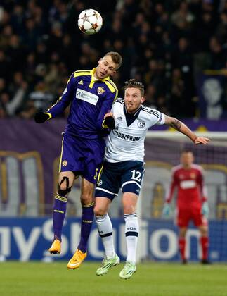 SOCCER - CL, Maribor vs Schalke MARIBOR,SLOVENIA,10.DEC.14 - SOCCER - UEFA Champions League, group stage, NK Maribor vs FC Schalke 04. Image shows Zeljko Filipovic (Maribor) and Marco Hoeger (Schalke).