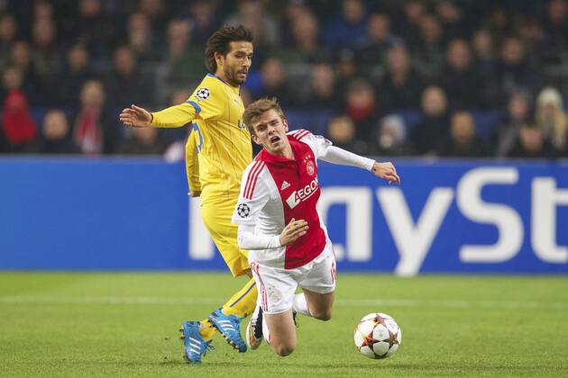 (L-R) Nuno Morais of Apoel FC, Lucas Andersen of Ajax during the UEFA Champions League group F match between Ajax Amsterdam and Apoel Nicosia on December 10, 2014 at the Amsterdam Arena in Amsterdam, The Netherlands. Auax Amsterdam v Apoel Nicosia UEFA Champions League Group F 2014 2015 xVIxxIVx 3344852