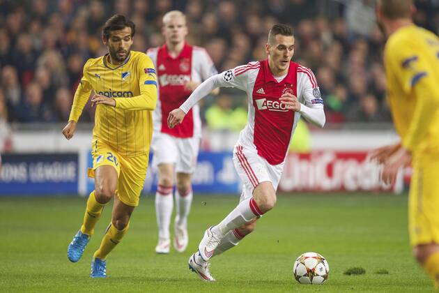 (L-R) Nuno Morais of Apoel FC, Arkadiusz Milik of Ajax during the UEFA Champions League group F match between Ajax Amsterdam and Apoel Nicosia on December 10, 2014 at the Amsterdam Arena in Amsterdam, The Netherlands. Auax Amsterdam v Apoel Nicosia UEFA Champions League Group F 2014 2015 xVIxxIVx 3344856