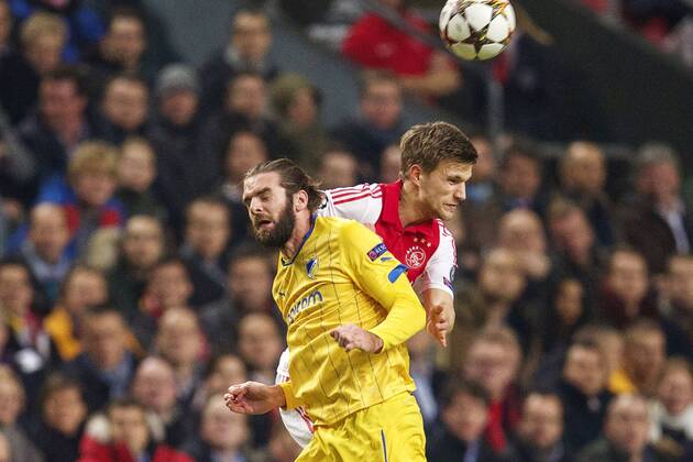 (L-R) Cillian Sheridan of Apoel FC, Joel Veltman of Ajax during the UEFA Champions League group F match between Ajax Amsterdam and Apoel Nicosia on December 10, 2014 at the Amsterdam Arena in Amsterdam, The Netherlands. Auax Amsterdam v Apoel Nicosia UEFA Champions League Group F 2014 2015 xVIxxIVx 3345007