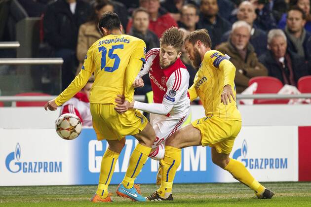 (L-R) Marios Antoniades of Apoel FC, Lasse Schone of Ajax, Nektarios Alexandrou of Apoel FC during the UEFA Champions League group F match between Ajax Amsterdam and Apoel Nicosia on December 10, 2014 at the Amsterdam Arena in Amsterdam, The Netherlands. Auax Amsterdam v Apoel Nicosia UEFA Champions League Group F 2014 2015 xVIxxIVx 3345011