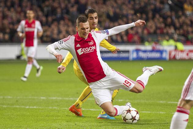 (L-R) Marios Antoniades of Apoel FC, Arkadiusz Milik of Ajax during the UEFA Champions League group F match between Ajax Amsterdam and Apoel Nicosia on December 10, 2014 at the Amsterdam Arena in Amsterdam, The Netherlands. Auax Amsterdam v Apoel Nicosia UEFA Champions League Group F 2014 2015 xVIxxIVx 3345130