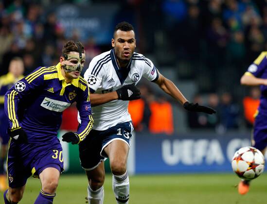 SOCCER - CL, Maribor vs Schalke MARIBOR,SLOVENIA,10.DEC.14 - SOCCER - UEFA Champions League, group stage, NK Maribor vs FC Schalke 04. Image shows Petar Stojanovic (Maribor) and Eric Maxim Choupo-Moting (Schalke).
