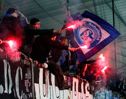 SOCCER - CL, Maribor vs Schalke MARIBOR,SLOVENIA,10.DEC.14 - SOCCER - UEFA Champions League, group stage, NK Maribor vs FC Schalke 04. Image shows the fans of FC Schalke 04. Keywords: bengal firework.