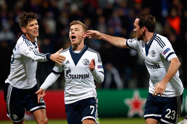 SOCCER - CL, Maribor vs Schalke MARIBOR,SLOVENIA,10.DEC.14 - SOCCER - UEFA Champions League, group stage, NK Maribor vs FC Schalke 04. Image shows the rejoicing of Klaas-Jan Huntelaar, Max Meyer and Christian Fuchs (Schalke).