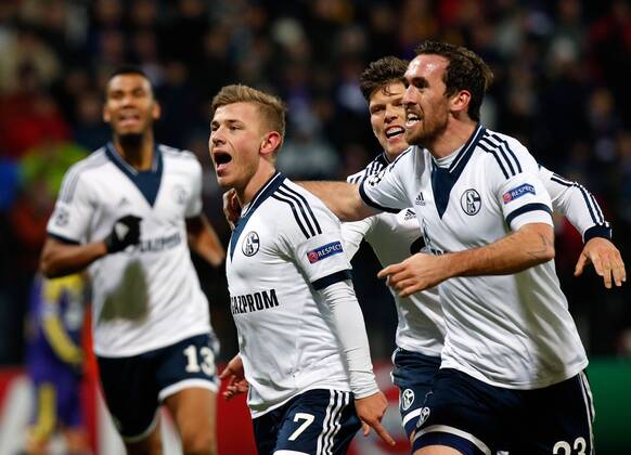 SOCCER - CL, Maribor vs Schalke MARIBOR,SLOVENIA,10.DEC.14 - SOCCER - UEFA Champions League, group stage, NK Maribor vs FC Schalke 04. Image shows the rejoicing of Max Meyer, Klaas-Jan Huntelaar and Christian Fuchs (Schalke).