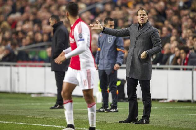(L-R) Ricardo Kishna of Ajax, coach Frank de Boer of Ajax during the UEFA Champions League group F match between Ajax Amsterdam and Apoel Nicosia on December 10, 2014 at the Amsterdam Arena in Amsterdam, The Netherlands. Auax Amsterdam v Apoel Nicosia UEFA Champions League Group F 2014 2015 xVIxxIVx 3345458