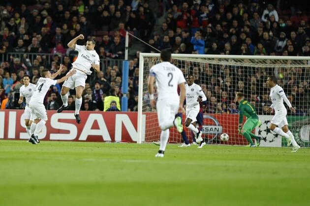 (141211) -- BARCELONA, Paris Saint-Germain s Zlatan Ibrahimovic (Top) celebrates scoring during the UEFA Champions League group F football match against Barcelona in Barcelona, Spain, on Dec. 10, 2014. Barcelona won 3-1. ) (SP)SPAIN-BARCELONA-SOCCER-UEFA PauxBarrena 