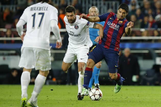 (141211) -- BARCELONA, Barcelona s Luis Suarez (R) vies for the ball during the UEFA Champions League group F football match against Paris Saint-Germain in Barcelona, Spain, on Dec. 10, 2014. Barcelona won 3-1. ) (SP)SPAIN-BARCELONA-SOCCER-UEFA PauxBarrena 