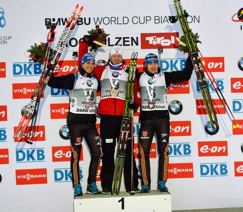 BIATHLON - IBU WC Hochfilzen HOCHFILZEN,AUSTRIA,12.DEZ.14 - BIATHLON, FLOWER CEREMONY - IBU World Cup, 10km sprint, men. Image shows Simon Schempp (GER), Johannes Thingnes Boe (NOR) and Andreas Birnbacher (GER). Keywords: award ceremony.