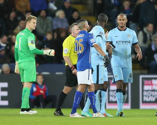 Vincent Kompany of Manchester City hands over the captains armband as he goes off injured during the second half - Barclays Premier League - Leicester City vs Manchester City - King Power Stadium - Leicester - England - 13th December 2014 - EDITORIAL USE ONLY. No use with unauthorised audio, video, data, fixture lists, club league logos or live services. Online in-match use limited to 120 images, no video emulation. No use in betting, games or single club league player publications.